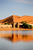 View at Auberge Yasmina at a lake in front of the dunes of Erg Chebbi desert, Morocco, Africa