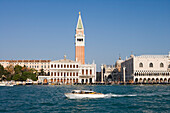 Water taxi with Campanile Tower and Basilica San Marco, Venice, Veneto, Italy