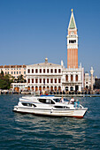 Le Boat Magnifique houseboat cruising past the Campanile Tower and Basilica San Marco, Venice, Veneto, Italy