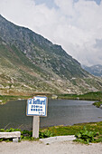 Signpost near a lake, Mountain landscape, Canton Uri, Swizterland