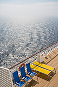 Sunloungers on the deserted deck of cruise ship AidaDiva
