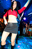 Young woman dancing at Mango's Nightclub, Ocean Drive, South Beach, Miami Beach, Florida, USA