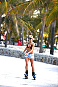 Young woman Inline Skating at Lummus Park, South Beach, Miami Beach, Florida, USA