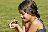 Girl with baby duck