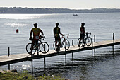 Lake Maxinkuckee, pier, bicycles, bikers. Culver Park. Culver. Indiana. USA.