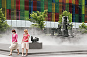 Canada, Montreal, Palais de Congrès, Convention Centre, Jean Paul Riopelle Square, public park, fog, women walk