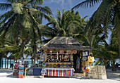 Along Mahahuals sandy business district, venders display their Mexican handicrafts in little huts along the shore, Costa Maya, Yucutan Peninsula, Mexico.