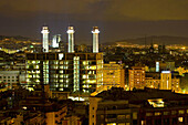 Panoramic view of Barcelona at night with the 'Tres Xemeneies' (Three chimneys, former textile industrial complex) and Fecsa Building. Avinguda del Paral.lel. Barcelona. Spain