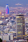 View of Barcelona at dusk with the Torre Colom in the foreground and Agbar Tower by architech Jean Nouvel at the background. Barcelona. Spain