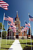 Eksjo Luthern Church with American flags in Lake Park Minnesota, USA.