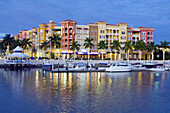 The marina and the Bayfront shopping and dining complex at dusk in Naples, Florida, USA, 2008