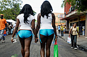 Two sexy ladies in their parade costume walking along Frederick Street during Carnival, Port of Spain, Island of Trinidad, Republic of Trinidad and Tobago