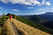 Woman hiking at Schildenstein, Mangfall range, Bavaria, Germany