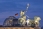 Quadriga on Brandenburg Gate, Berlin, Germany, Reichstag dome in background, Berlin, Germany