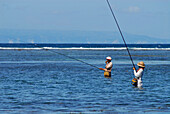 Fishermen angling in the lagoon, Nusa Dua, Bali, Indonesia, Asia