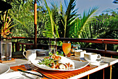 A table is laid out for breakfast at Hotel Four Seasons, Sayan, Ubud, Central Bali, Indonesia, Asia