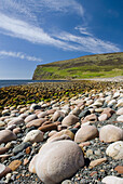 Giant rounded cobblestones lining the beach at Rackwick Isle of Hoy, Orkney Islands Scotland