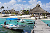 Dock and Fishing boat at Puerto Morelos. Caribe. Quintana Roo state. Mayan Riviera. Yucatan Peninsula. Mexico