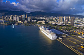 Norwegian Cruise Line's Pride of Aloha cruise ship docked in Downtown Honolulu, Oahu, Hawaii, USA