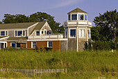 A house with a lighthouse, on the beach at Rock Harbor, Orleans, Cape Cod, Massachusetts, USA