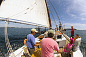 On the deck of the Schooner Nathaniel Bowditch sailing in Penobscot Bay, Maine USA