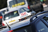 TAXI sign on top of a parisian taxi. Paris. France