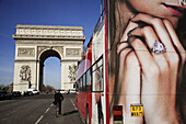 Tour bus with Arc de Triomphe in the background. Paris. France
