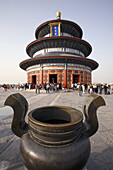 An incense burner in Temple of Heaven with Qinian Hall (Hall of Prayer for good harvest) in background. Beijing. China