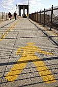 Pedestrian sign mark the walking way of Brooklyn Bridge. New York City. USA