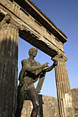 The statue of Apollo in the Temple of Apollo in the ancient ruins city of Pompei. Campania. Italy