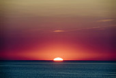 Sunset at 54 degrees north. Jutland Denmark. Orange sky and a deep blue sea.