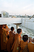 Monks on a ferry, Bangkok, Thailand