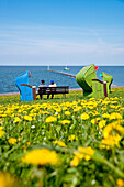 Beach chairs on dyke, Pellworm Island, North Frisian Islands, Schleswig-Holstein, Germany