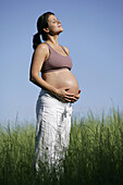 Pregnant woman with closed eyes, Styria, Austria