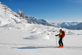 Cross-country skier in a winter landscape under blue sky, Pflerscher valley, South Tyrol, Italy, Europe