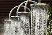 Shower heads with drops of water, Therme Meran, Thermal spa, Merano, South Tyrol, Italy