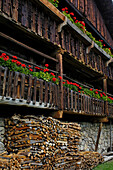 Balcony with geraniums, Farmhouse in the South Tyrolean local history museum at Dietenheim, Puster Valley, South Tyrol, Italy