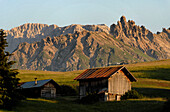 Wooden hut in the middle of an alpine pasture, Seiser Alm, Schlern, South Tyrol, Italien