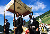 Procession through Sarntal, Men and women in traditional costume, South Tyrol, Italy