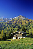 Alpine hut at Passo di Costalunga, view to Latemar, Dolomite Alps, South Tyrol, Italy