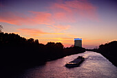 Cargo ship on Rhine Herne canal at the Gasometer Oberhausen, Ruhr, Ruhr area, North Rhine Westphalia, Germany