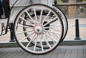 Close-up of horse drawn carriage wheels at Bethesda Fountain Terrace, Central Park, New York, USA