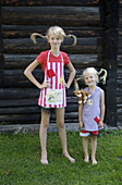 Two sisters with braids in their hair, costume party theme.