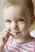 Little Girl Eating Snack
