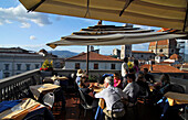 People at the cafe at roof terrace of the department store La Rinascente with view at the cathedral, Florence, Tuscany, Italy, Europe