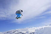 Snowboarder in mid-air, ski area Soelden, Oetztal, Tyrol, Austria