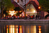 View over river Isar to an illuminated beergarden, Landshut, Lower Bavaria, Bavaria, Germany