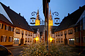 Mirroring of houses at night, Wolframs-Eschenbach, Middle Franconia, Bavaria, Germany