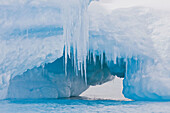 Whimsical ice caves formed by wind and sea in this iceberg detail in and around the Antarctic Peninsula during the summer months  More icebergs are being created as global warming is causing the breakup of major ice shelves and glaciers