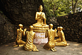 Statue of Buddha and monks in Luang Prabang, Laos, 2008